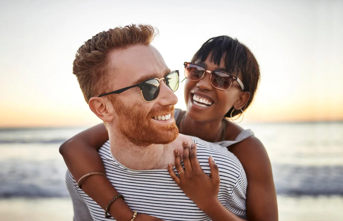 happy young couple spending the day at the beach