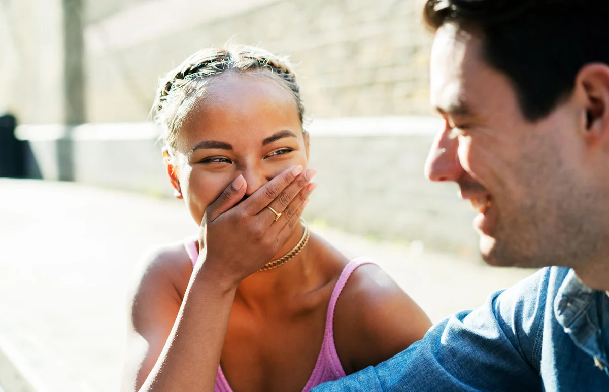 Two friends talking and laughing