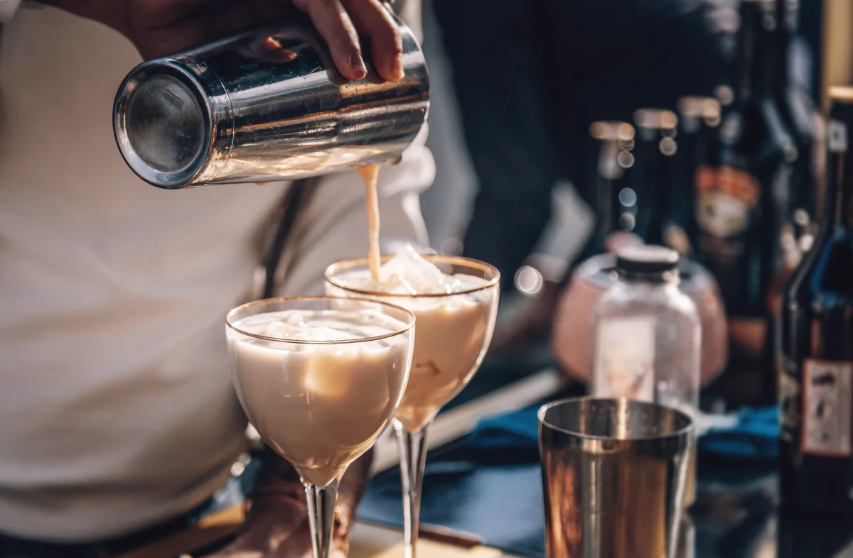 Bartender making Baileys cocktail
