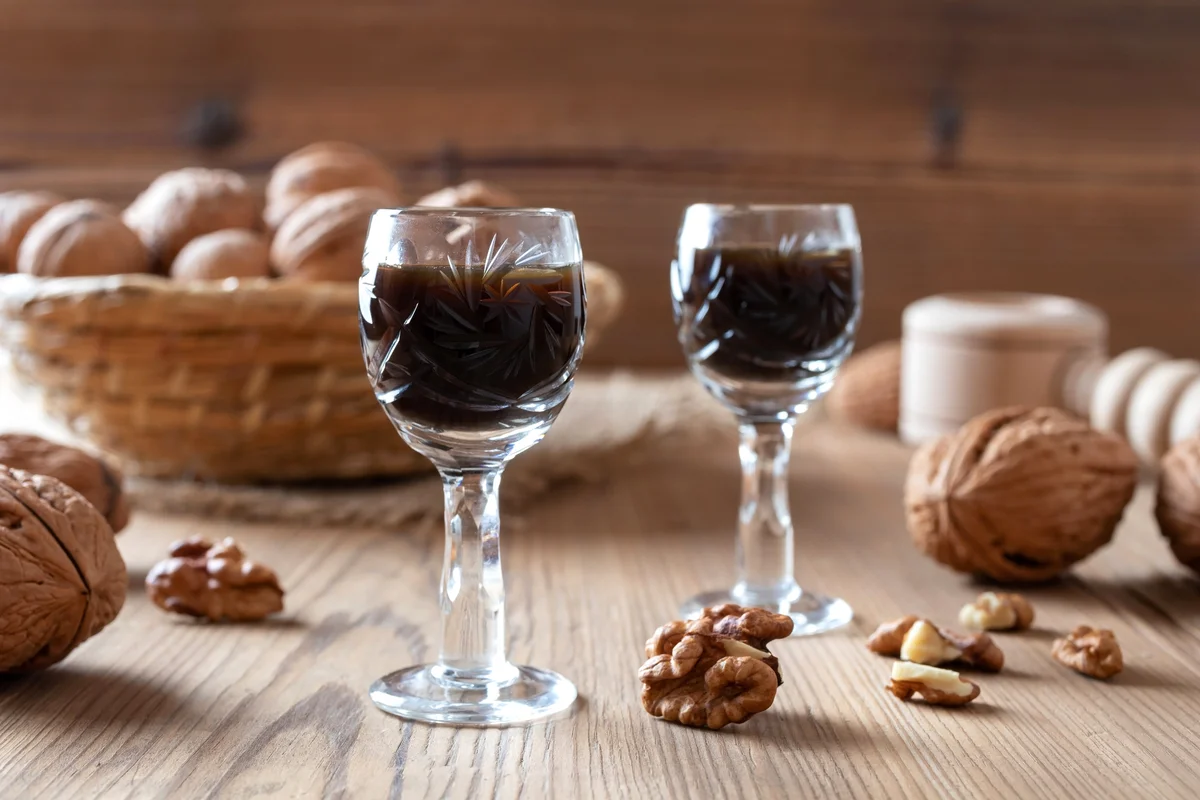 Two Glasses Of Chocolate Liqueur With Walnuts