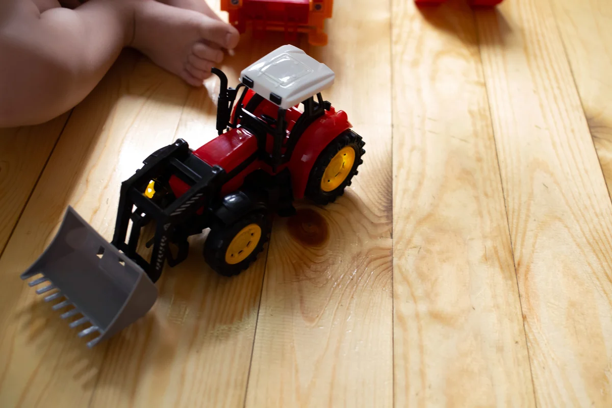 Toy tractor and baby
