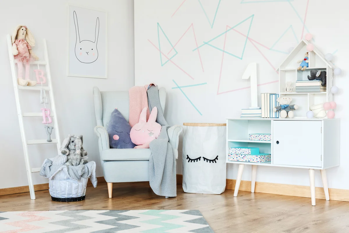 Elegant kid room interior decorated in Scandinavian style with modern furniture and geometric figures