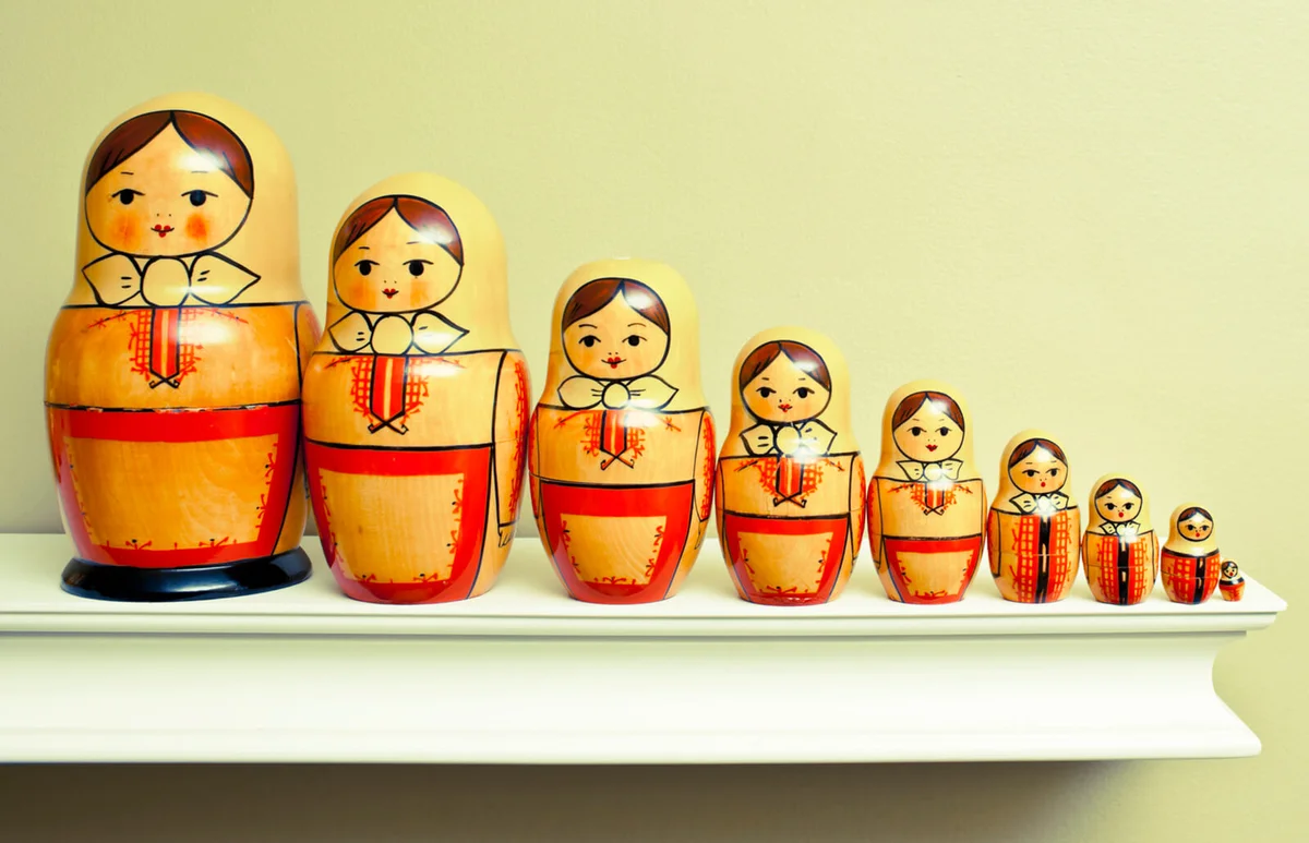 Russian nesting dolls all in a row on a ledge