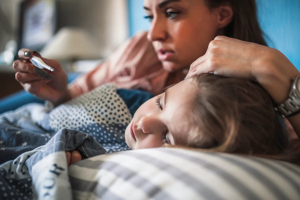 Mom Mesuring Temperature On Sick Child