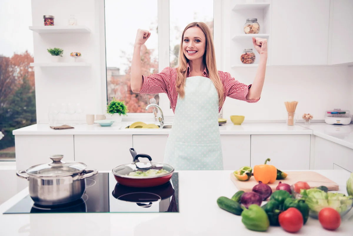 Mom preparares a delicious and healthy meal for family