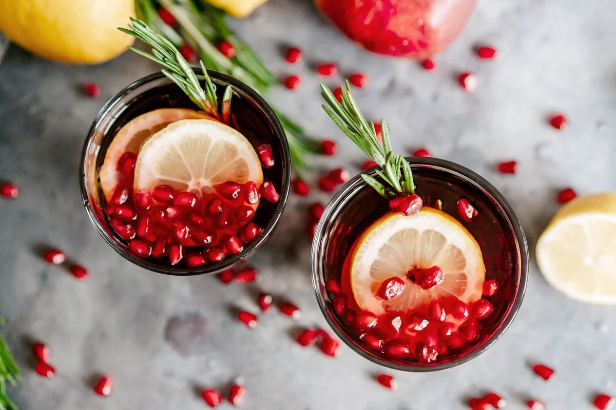 Pomegranate shirley temple with lemon and rosemary