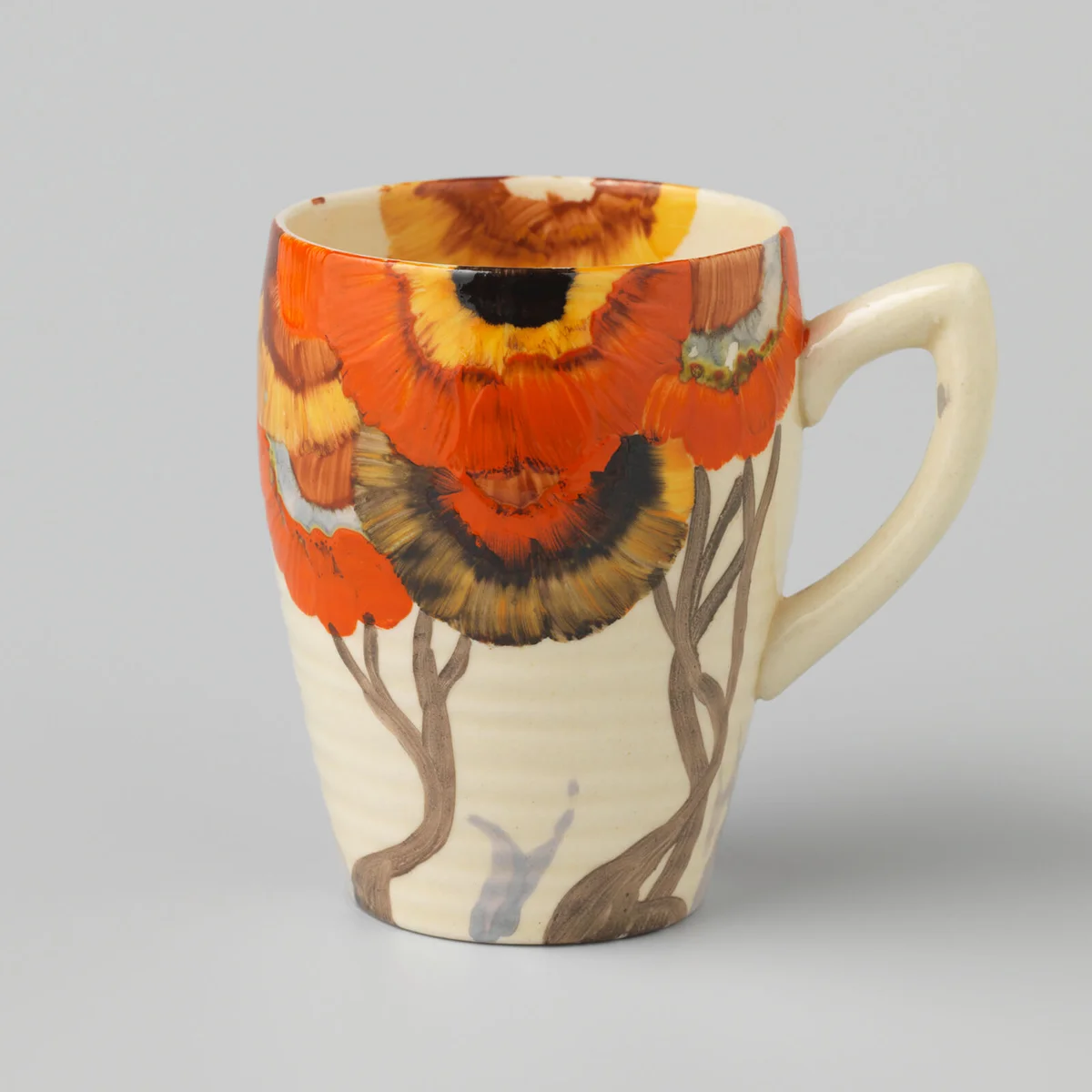 Teacup with multicolored floral decor by CLARICE CLIFF