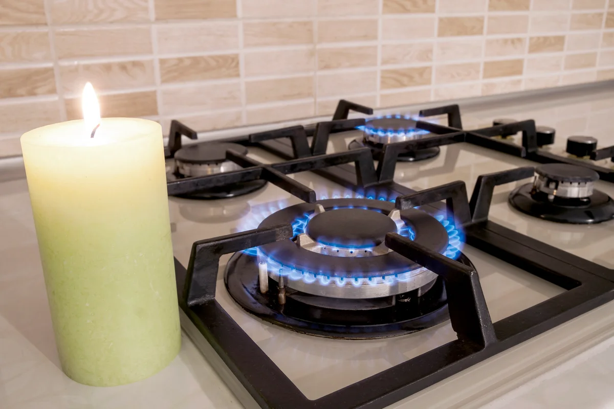 Gas cooker with burning flames propane gas and candle