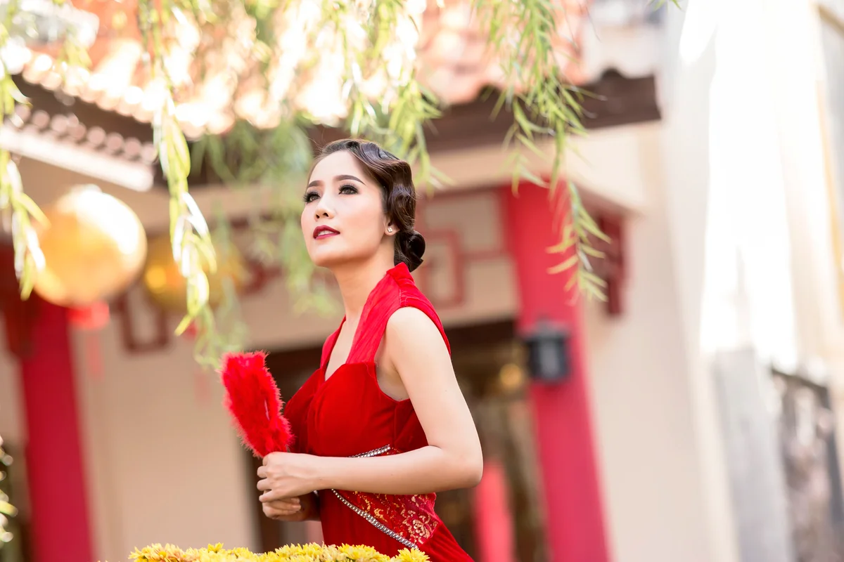 Chinese woman in red dress traditional in Chinese temple