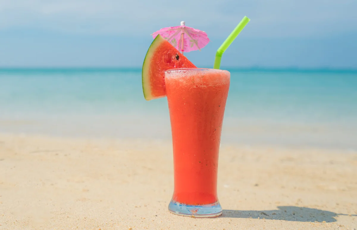 Watermelon cocktail on blue tropical summer beach
