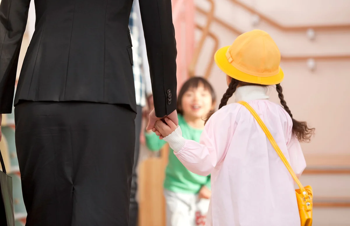 Working Woman Dropping Daughter off Day-care Center