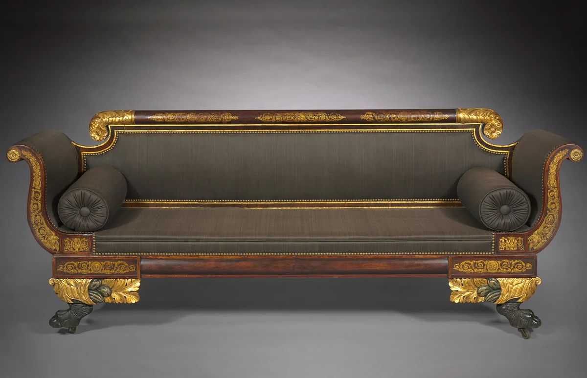 The classically inspired elements of design such as the scrolled arms and the well executed gilt decoration identifies this sofa as an example of American Empire style furniture almost certainly made in New York City.