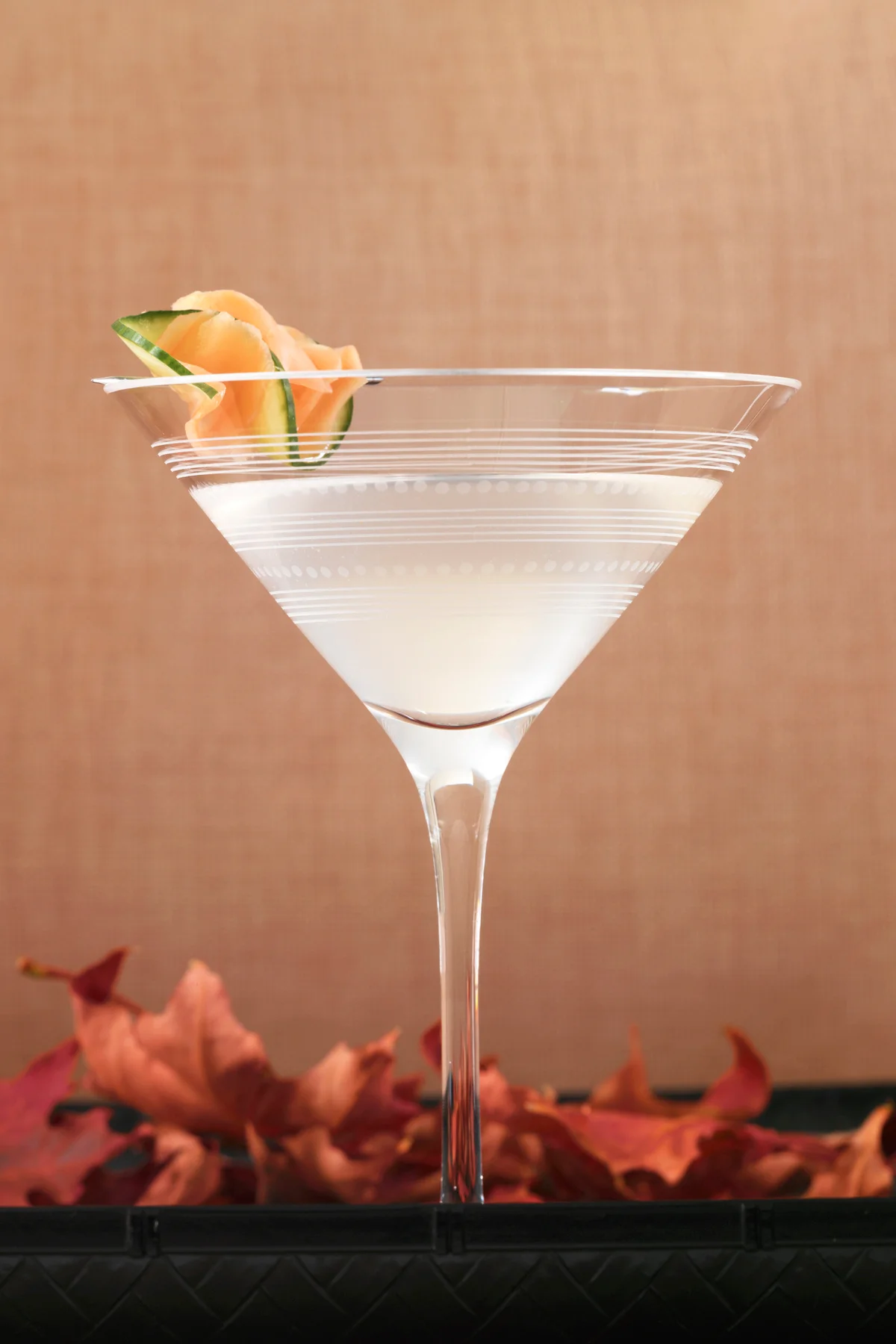 Ginger cocktail garnished with slices of cucumber