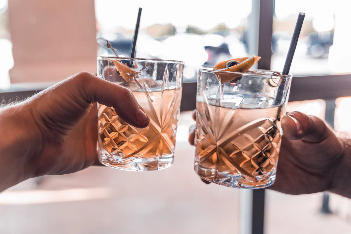 Two old fashioned drinks celebrated with close friends