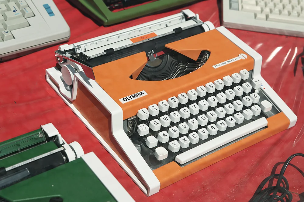 Orange Olympia typewriter for sale