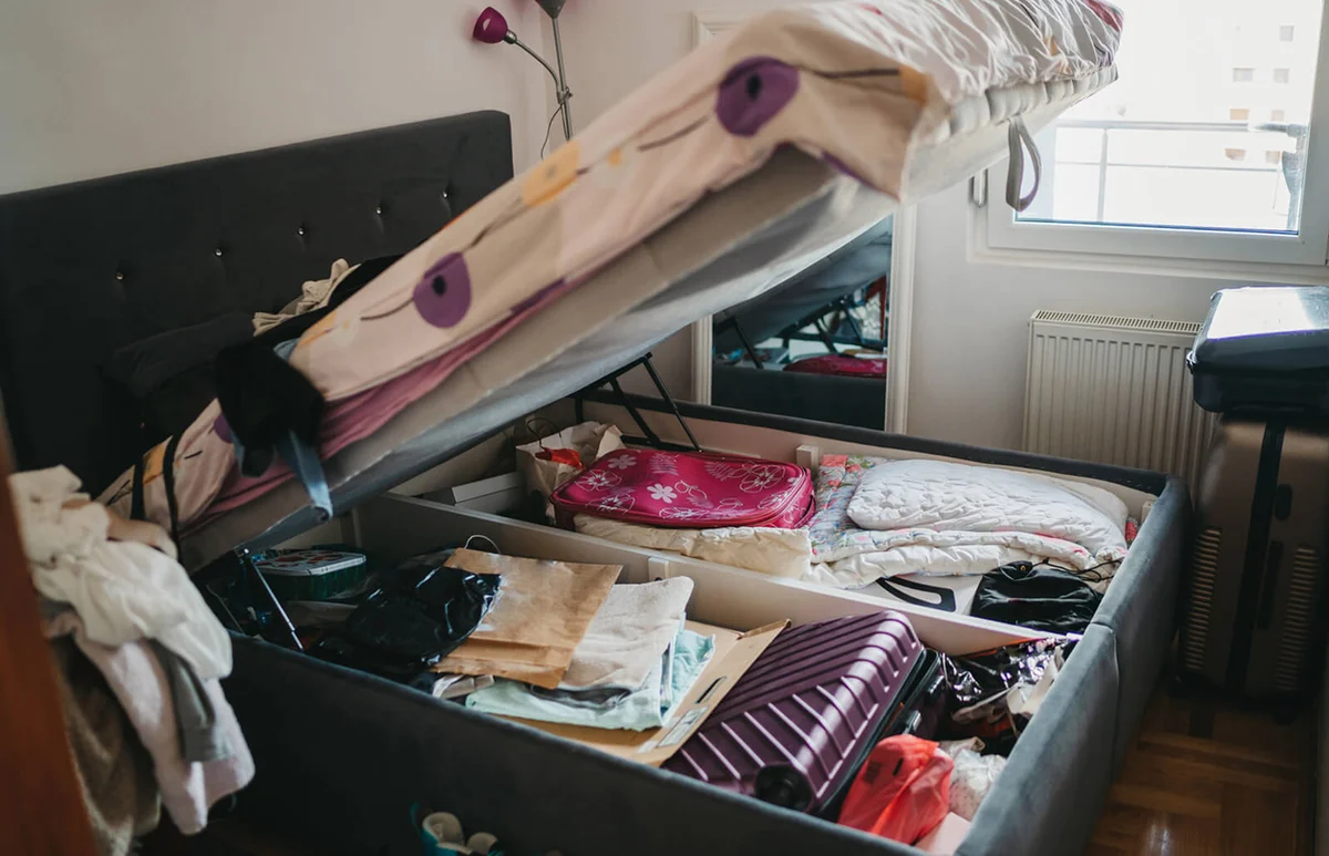 Pile of things in the bed drawer