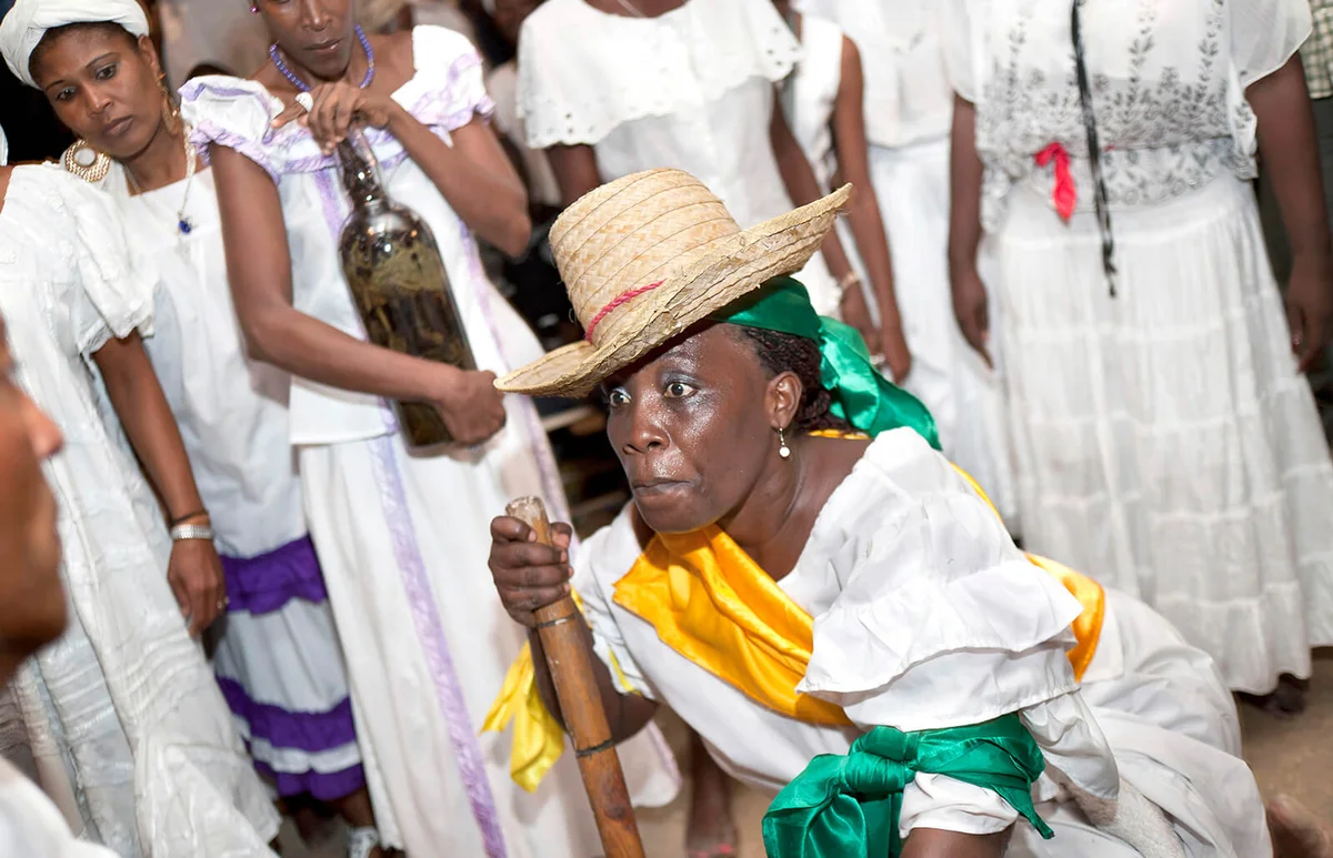 In celebration of the Day of the Dead, Haitians participate in a Voodoo ceremony in Petionville, Port-au-Prince, on November 2 | Getty Editorial Use