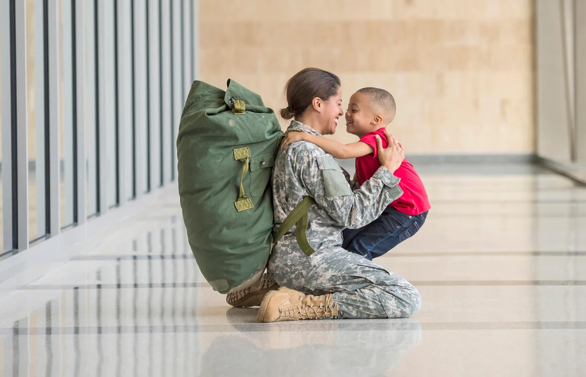 American soldier hugging son in airport