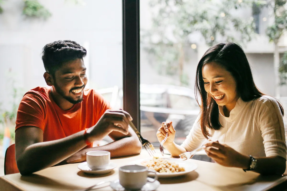 Young couple having pizza together