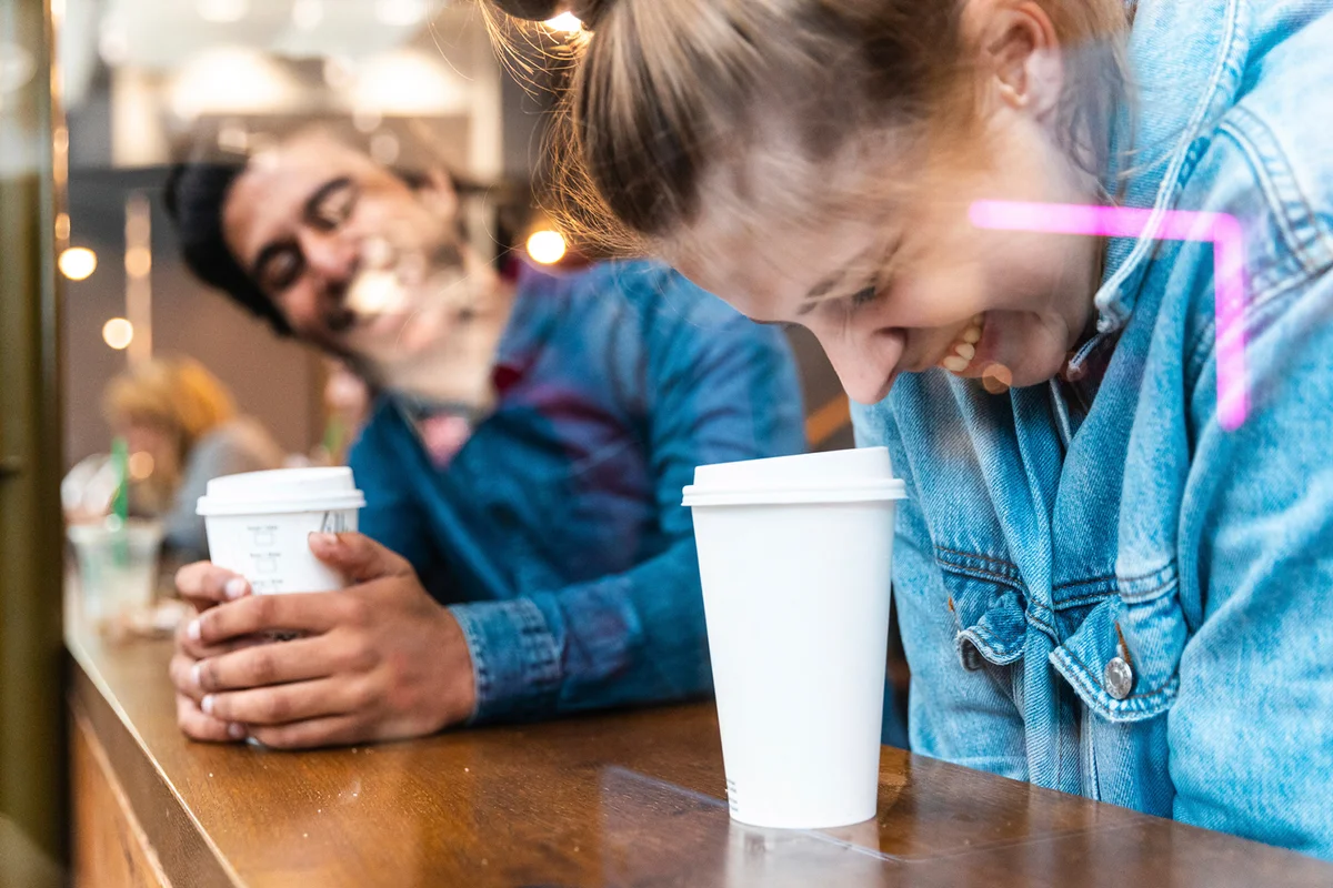 Couple having fun together in a coffee shop