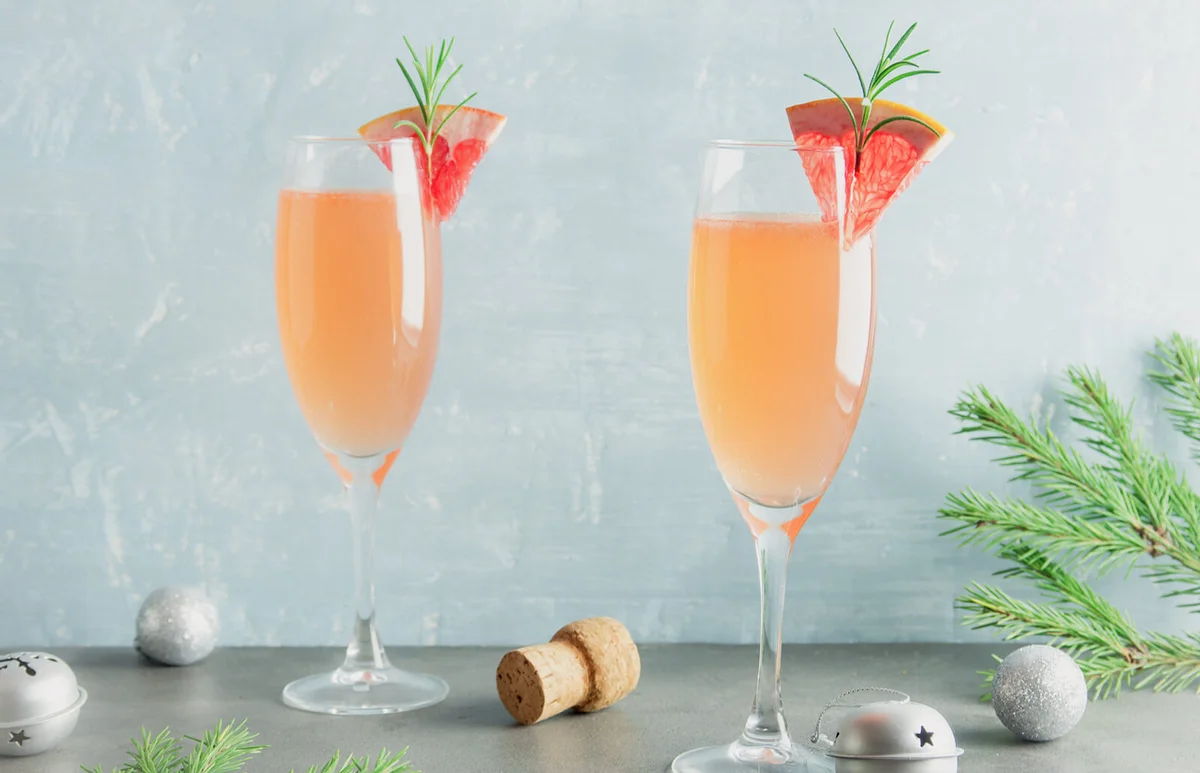 Champagne cocktail Mimosa with Grapefruit and Rosemary for Christmas party