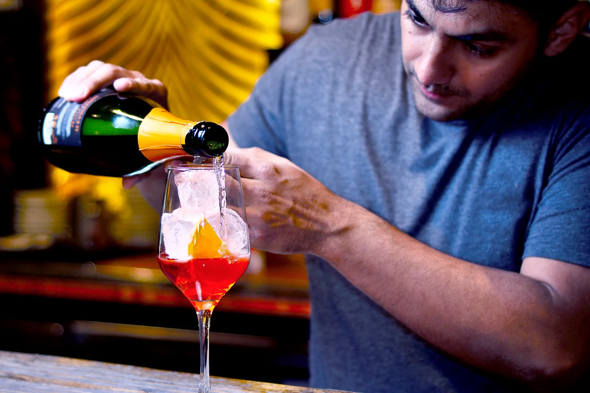 Bartender preparing a spritz aperol