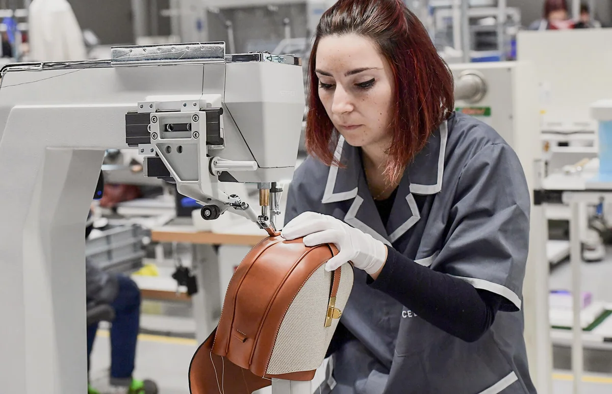 An Employee sews a Celine handbag at "La Manufacture", luxury leather goods Celine's new factory in Radda in Chianti, south of Florence, Tuscany, on October 17, 2019 | Getty Editorial Use