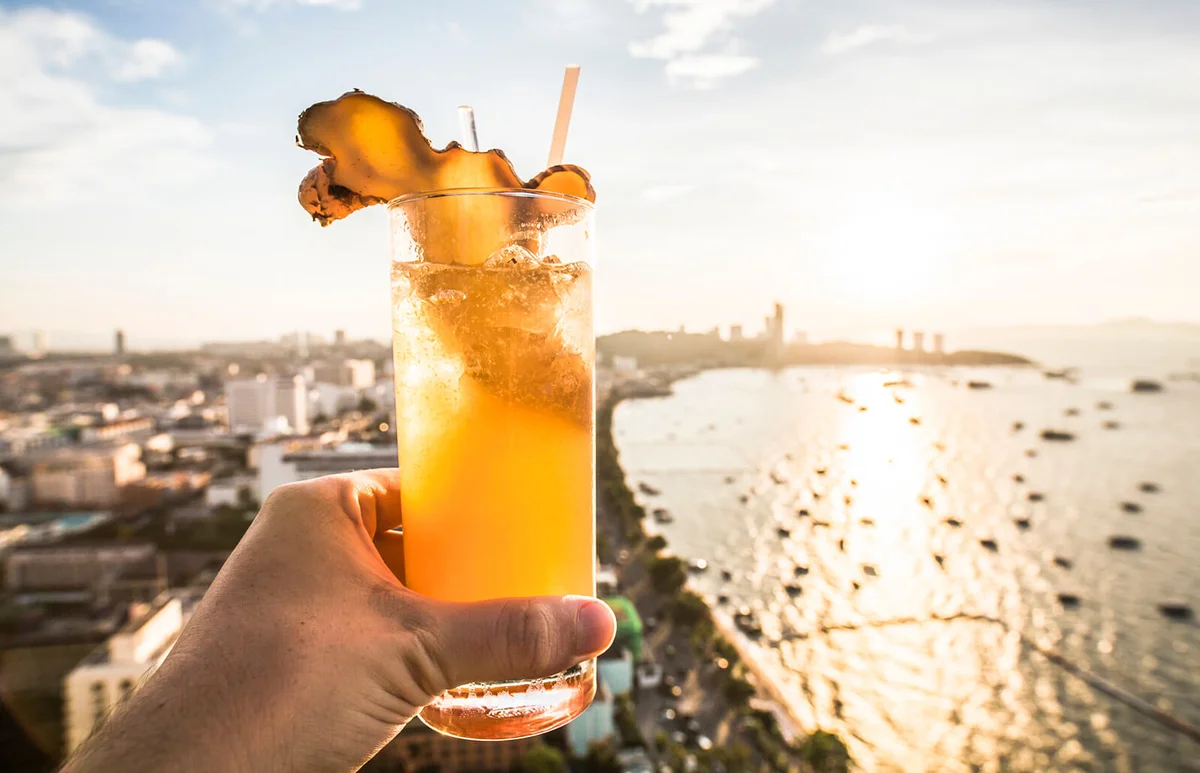 Vanilla Chai Cocktail against a sunset
