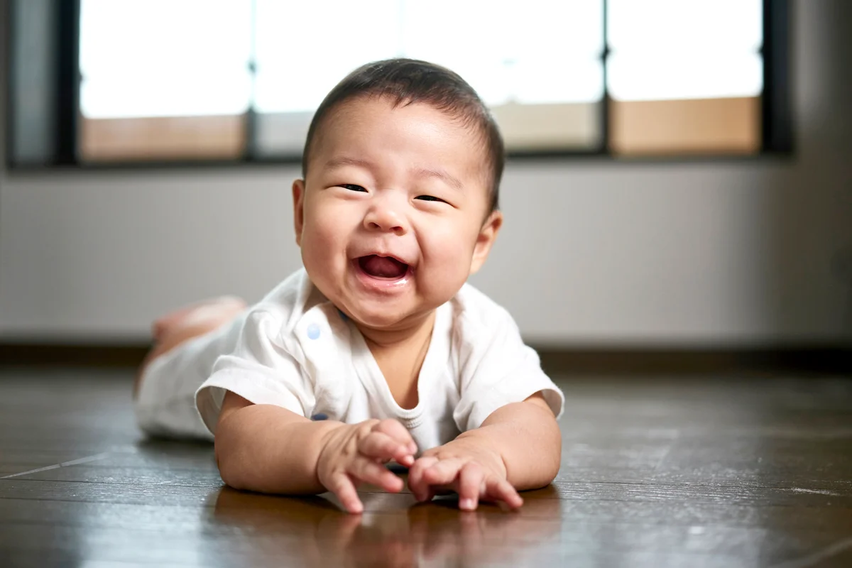 A six month old Japanese baby boy inside a home