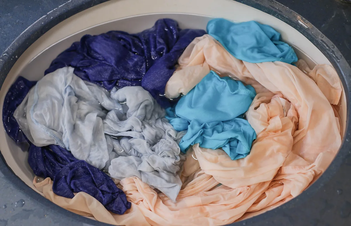 Wet garments in the sink after hand Laundry