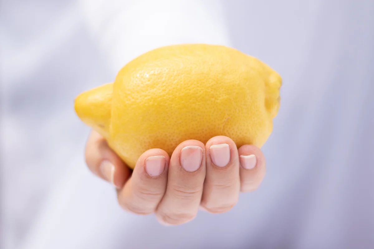 lemon in hand, focus on fruit