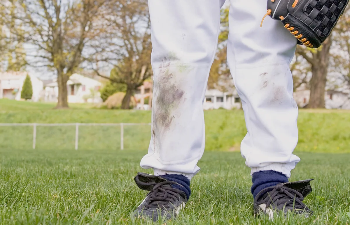 Young boy's dirty baseball uniform