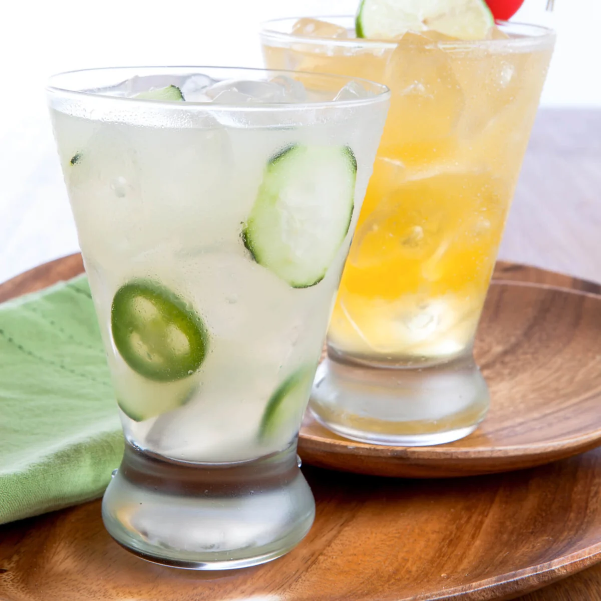 two spicy margaritas on wood plates