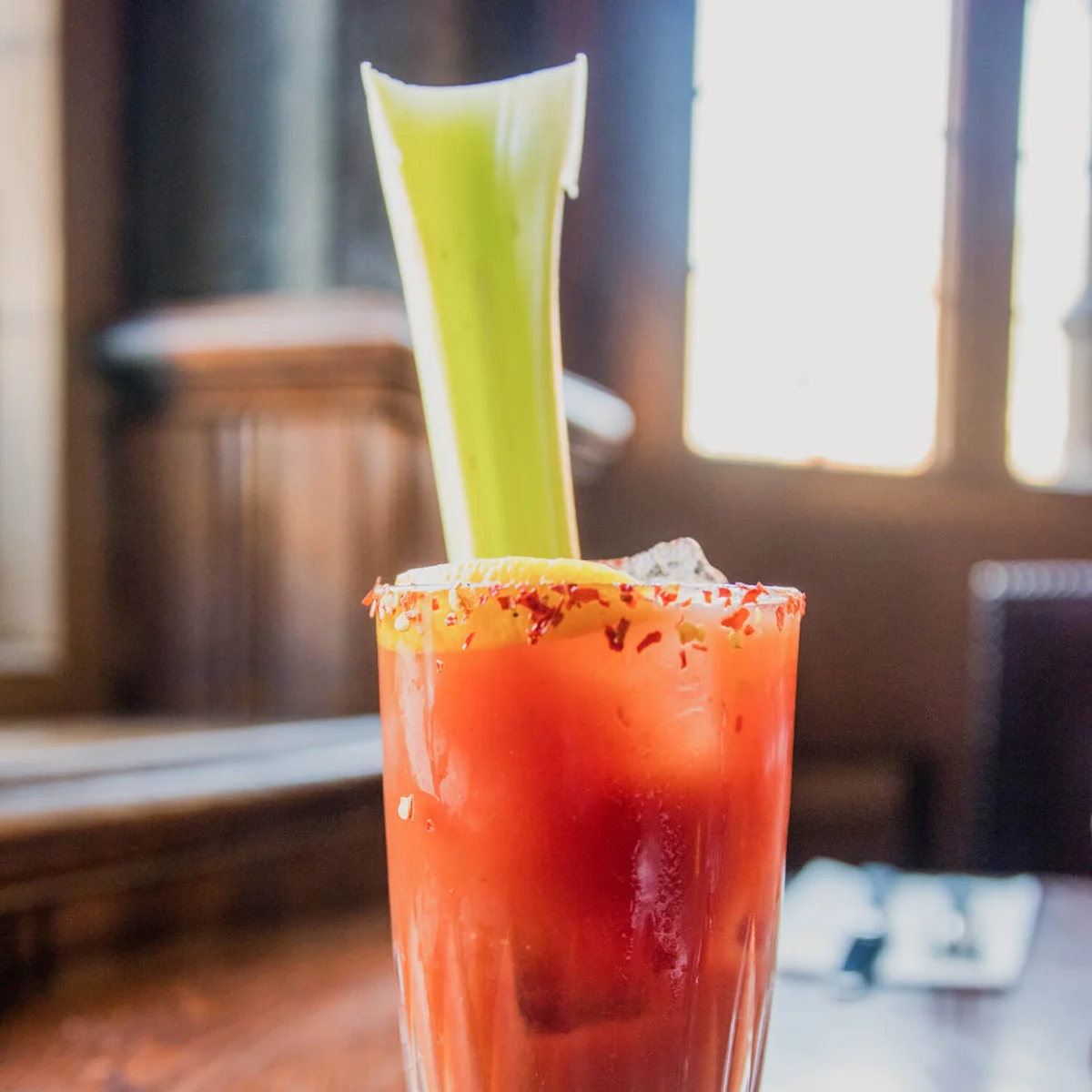 Bloody Mary cocktail with a large celery stick