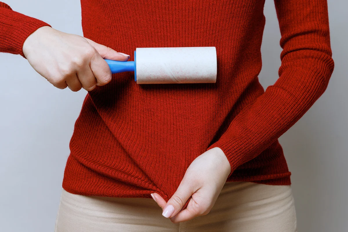 Woman Holding Brush Against White Background