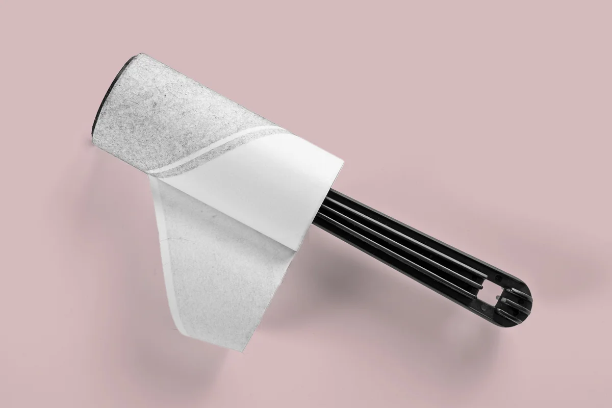 A lint brush used to remove excess fabric and particles from cloth