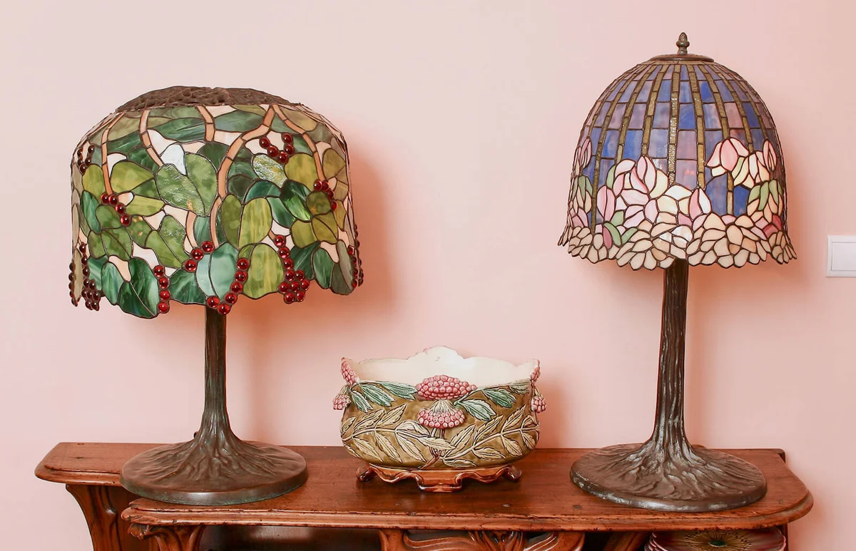 Two Tiffany lamps (1900's) and a barbotine basket on Maxim's furniture | Getty Editorial Use