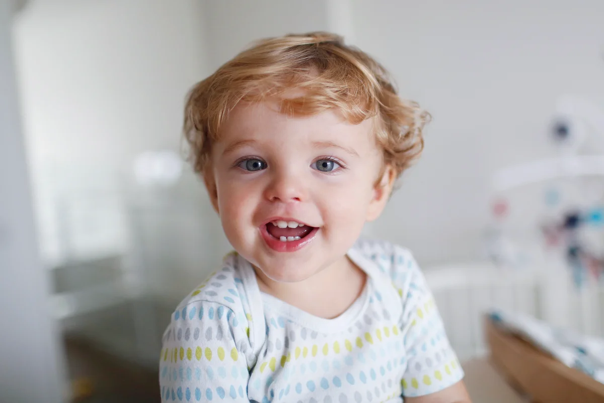 A 15 months old boy smiling