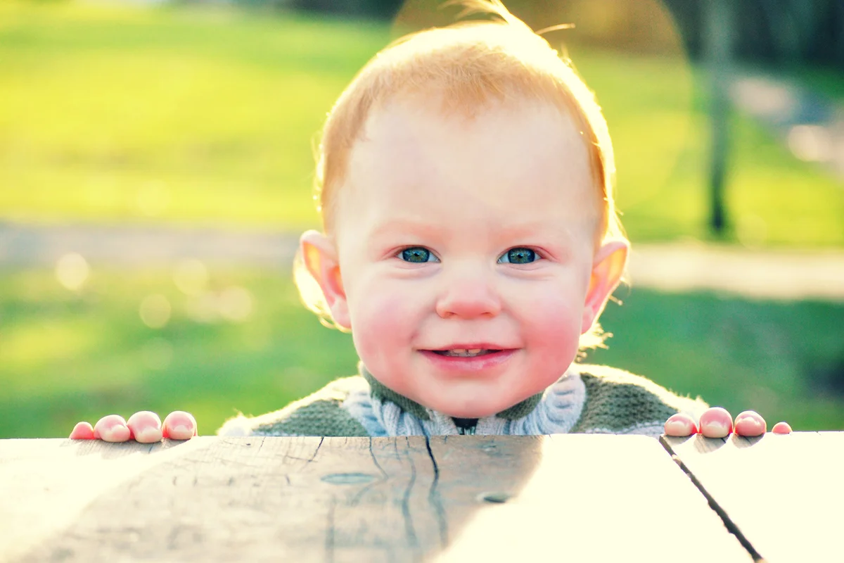 Smiling baby boy outside