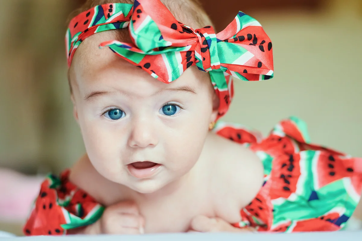 Portrait of dressed baby girl with hair-band