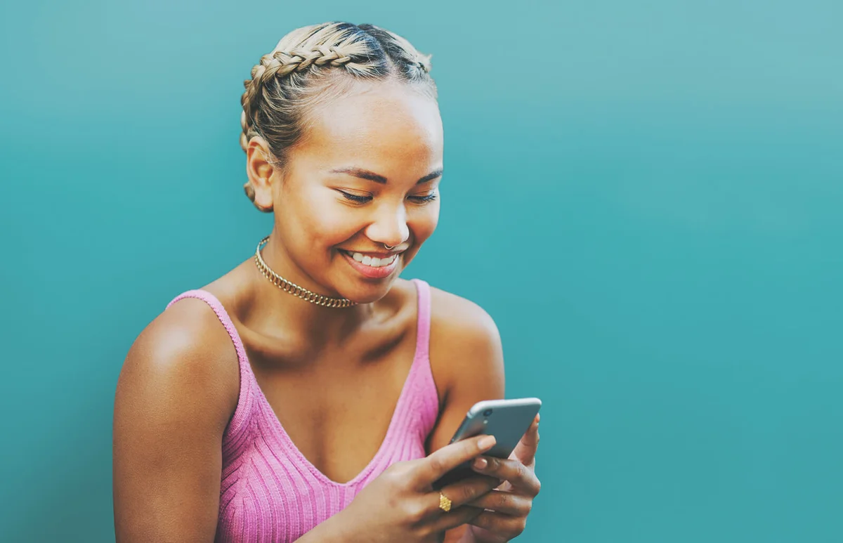 Woman smiling with smart phone