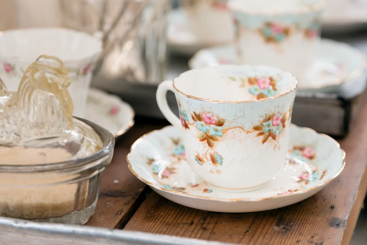 Vintage teacup and saucer on wooden table