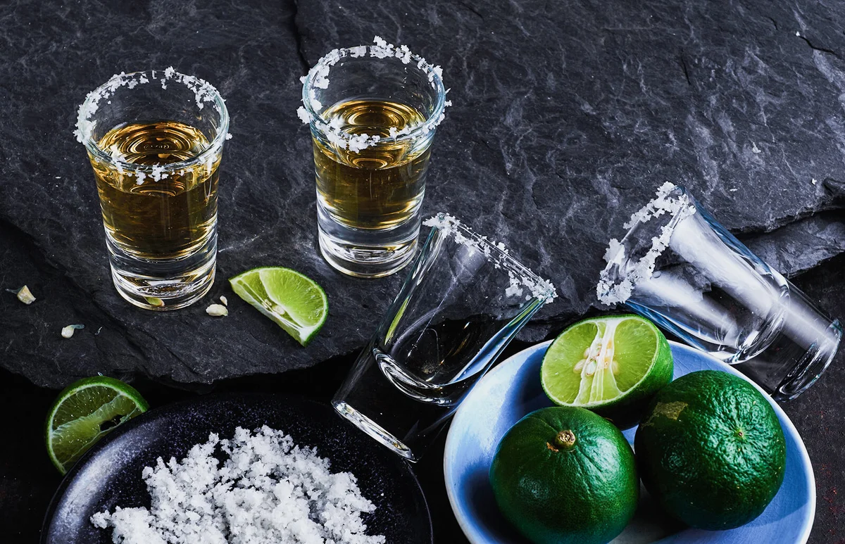 Tequila Shots By Lime And Salt On Table
