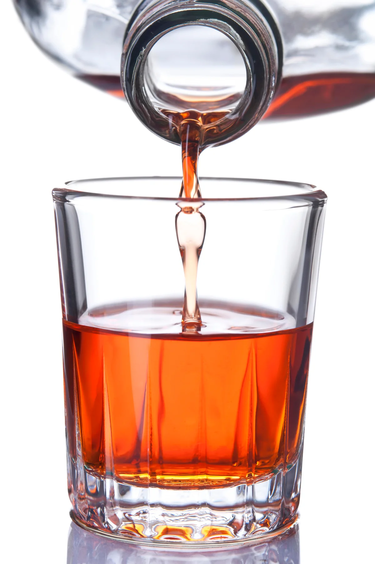 Shot glass filled with alcoholic drink