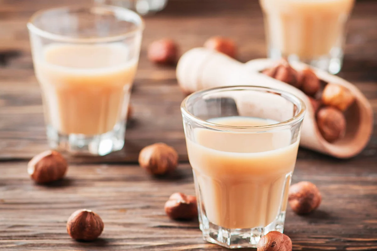 Traditional Italian hazelnut liqueur on the wooden table