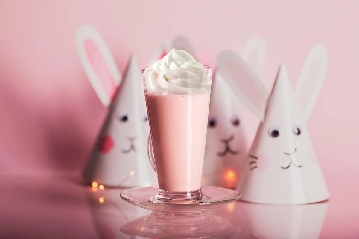 Pink cocktail in glass jar with bunny paper hats