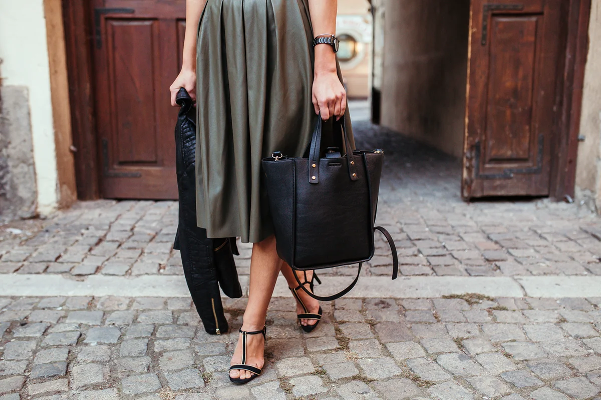 Girl with leather handbag
