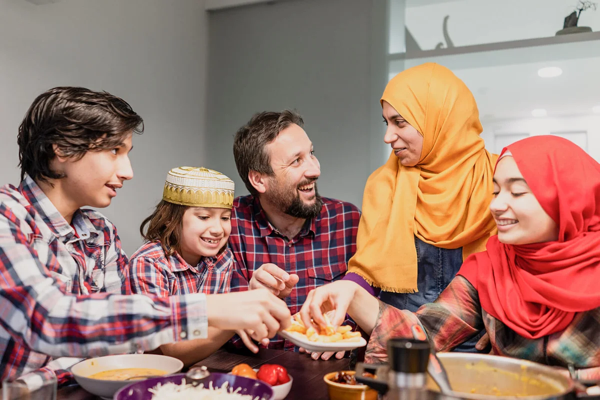 Family eating Iftar and enjoying breaking of fasting