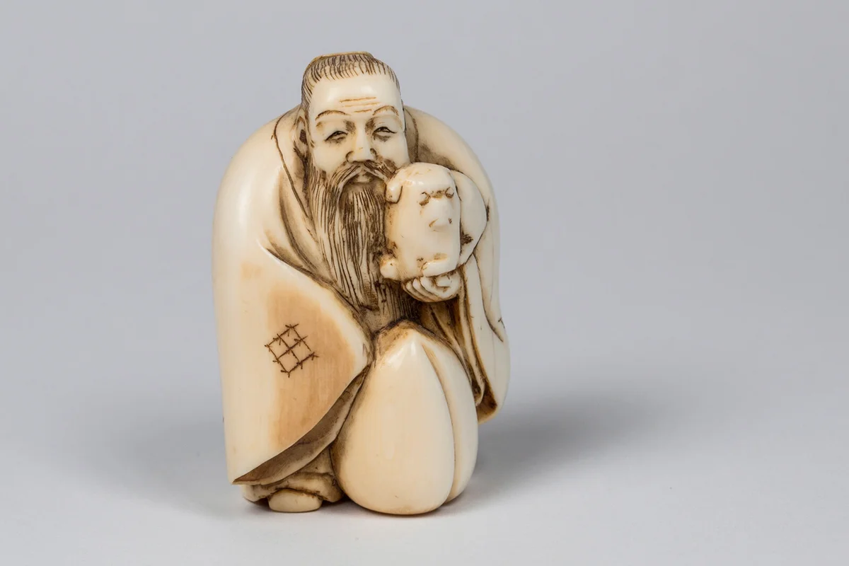 An antique Japanese netsuke carved in ivory