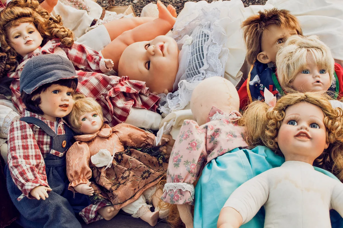 large group of old vintage dolls in a flea market in Berlin, Germany